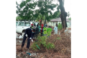 NGO Representatives and Community Member Take part in a Clean-Up
